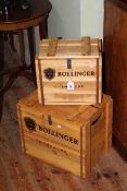 Two crates labelled Bollinger Champagne.
