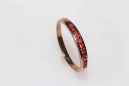 9 carat gold eleven ruby channel set ring, size Z.