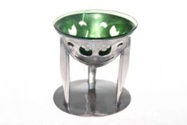 Liberty and Co Tudric pewter three legged tazza by Archibald Knox with green glass liner, no. 0276.