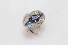 18 carat white gold tanzanite, sapphire and diamond ring featuring one oval cut tanzanite,