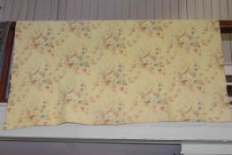 Hand stitched Durham quilt with floral design on a yellow ground.
