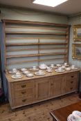 Large pine dresser with open rack,
