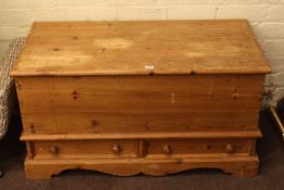 Stripped pine box with two external drawers.