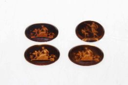 Four small oval glass intaglios.