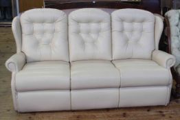 Sherbourne cream leather button back three seater reclining modular sofa.