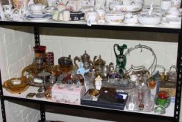 Shelf of metalwares, ceramics, perfume bottles and glass.