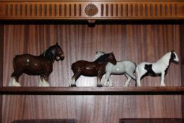 Four Beswick horse figures and one similar.