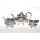 George IV silver three piece tea service, each circular lobed body with embossed decoration,