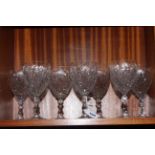 A set of seven good quality crystal wine glasses.