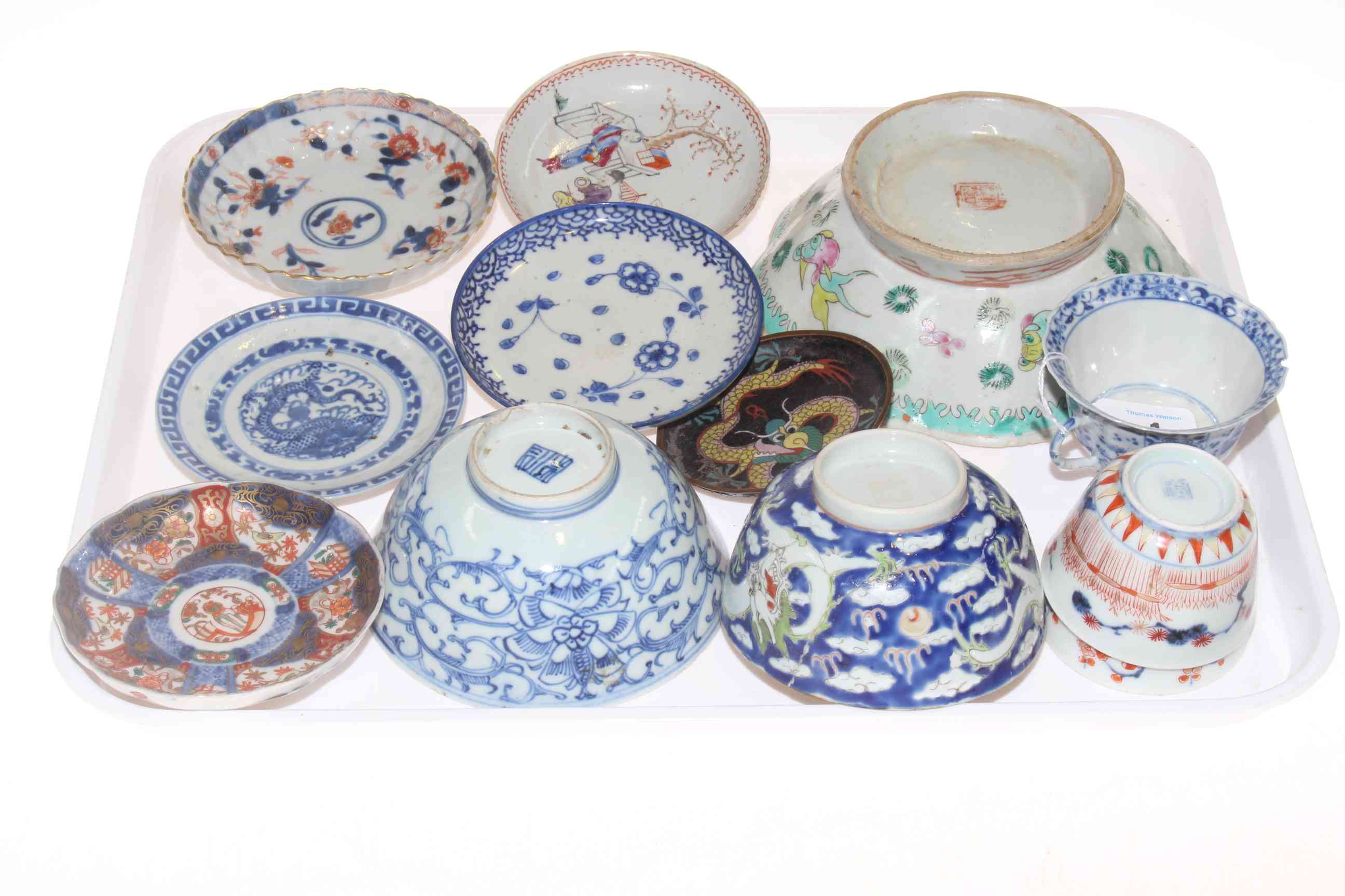 Collection of twelve Chinese blue and white and polychrome saucers, tea bowls and bowls.