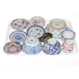 Collection of twelve Chinese blue and white and polychrome saucers, tea bowls and bowls.