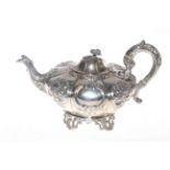 19th Century Irish silver teapot, of lobed form with embossed and chased decoration,