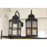 Pair of glass panelled outdoor lanterns.