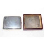 Two silver cigarette cases.