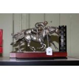 Two Royal Selanger horse racing ornaments on wooden plinths by R. Cameron.