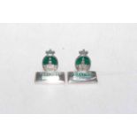Pair of silver and green enamel menu holders, the oval depicting The Royal Exchange, London,