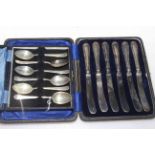 Cased set of six silver coffee spoons and cased tea knives (2).