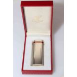 Cartier Paris engine-turned gas cigarette lighter, in original case with outer box,