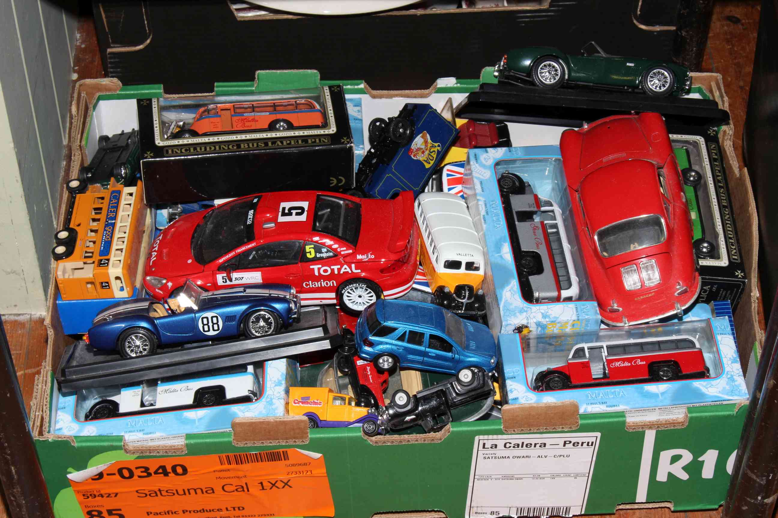 Collection of boxed and other model vehicles.