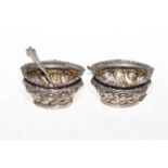 Pair Edwardian silver embossed open salts, Birmingham, with Chester hallmarked spoons.