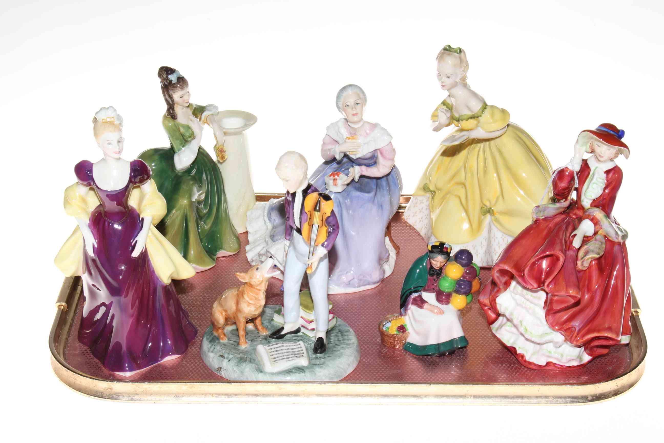 Seven Royal Doulton figurines including The Young Master, Happy Anniversary and The Last Waltz.