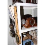 Five various mantel clocks, wall clock and two barometers.