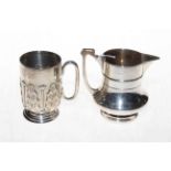 Edwardian silver embossed christening mug, Birmingham 1909, and silver cream jug (2).