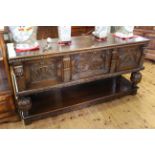 Berick Furniture carved oak potboard dresser having two carved central drawers flanked by two