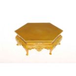 Chinese porcelain yellow glazed hexagonal stand having shaped and moulded frieze on cabriole legs,