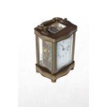French gilt brass carriage clock with serpentine sided frame.