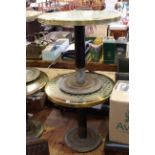 Two brass diamond pattern circular pub tables.