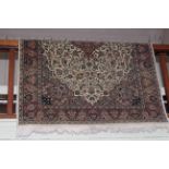 Eastern design rug, 230cm by 140cm.