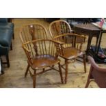 Pair Windsor elm pierced splat back elbow chairs.