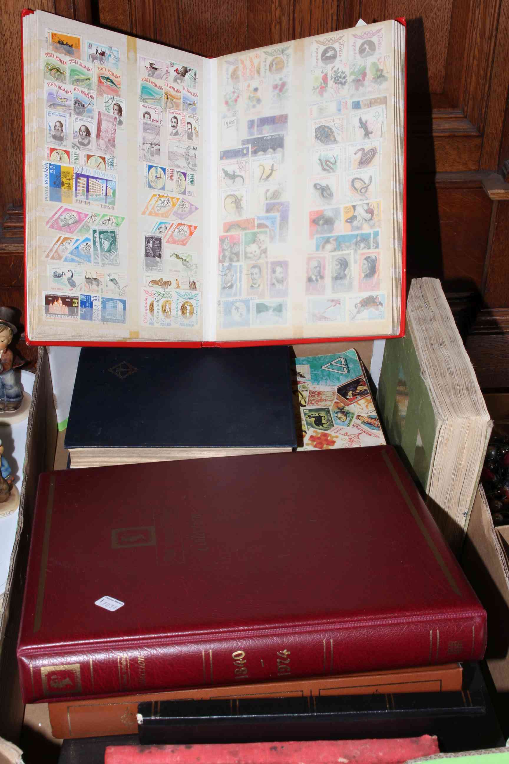Box containing sixteen assorted stamp albums.