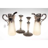 Pair of silver on copper mounted claret jugs with ribbed semi-opaque glass bodies,