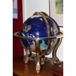 Semi-precious stone terrestrial globe on gilt metal stand.