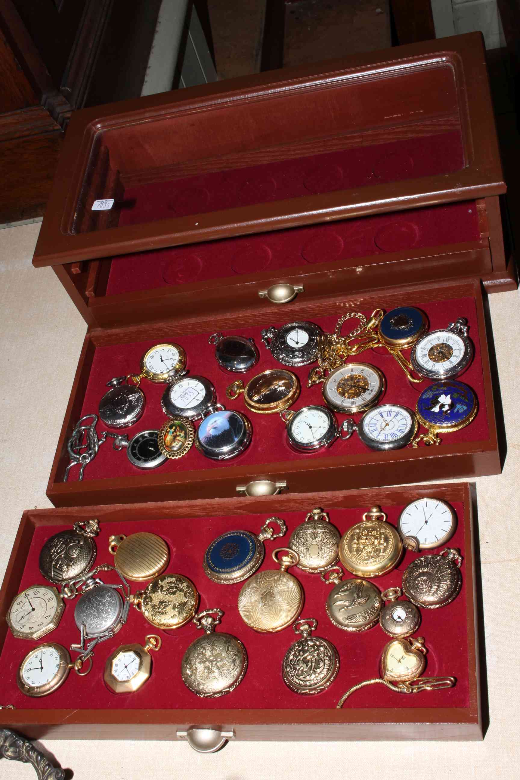 Table display cabinet and collection of pocket watches.