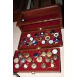 Table display cabinet and collection of pocket watches.