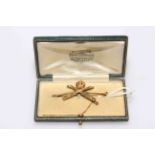 15 carat gold crossed machine gun pin, boxed.