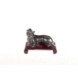 Chinese bronze tiger on wood stand, 10cm length.