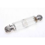 Glass double ended scent bottle with white metal mounts.