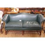 Green studded leather arched back settee on square moulded legs, 194cm long.