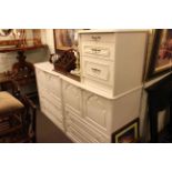 Pair two drawer linen chests and similar three drawer pedestal (3).