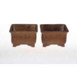 Pair Chinese Zisha Yixing planters having incised decoration, 11cm across.