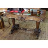 19th Century rosewood centre table having shaped frieze and side drawer raised on tapering pillars