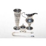 George III silver cream jug, embossed silver spill vase, Bateman tongs, and caster top only (4).