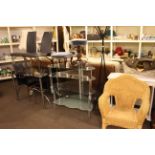 Tinted glass and chrome dining table and four chairs, two glass and chrome television stands,