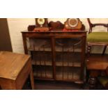 1920's mahogany two door china cabinet on ball and claw legs.