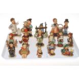 Collection of sixteen Hummel figures.