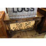 Continental oak and wrought iron two drawer console table, 77cm by 120cm.